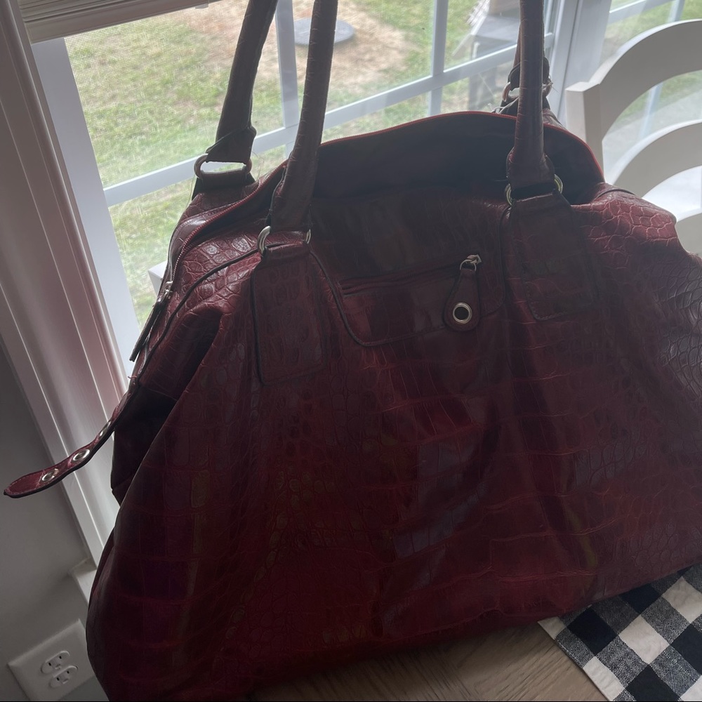 Red leather bag. Great for travel!